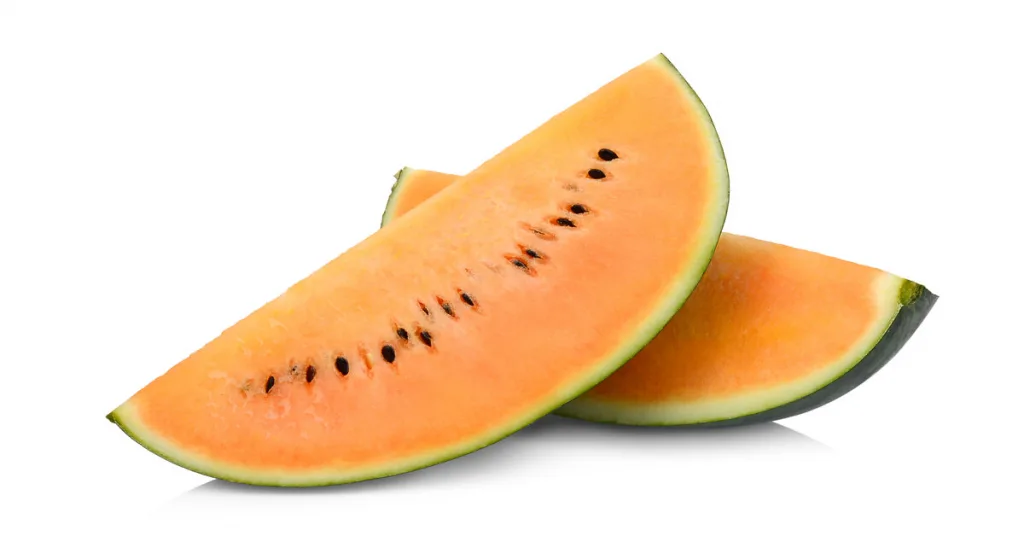 Orange watermelon sliced in half