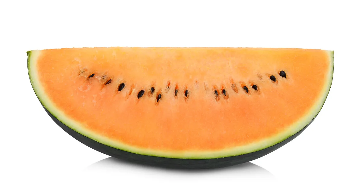 Orange variety of watermelon cut in half