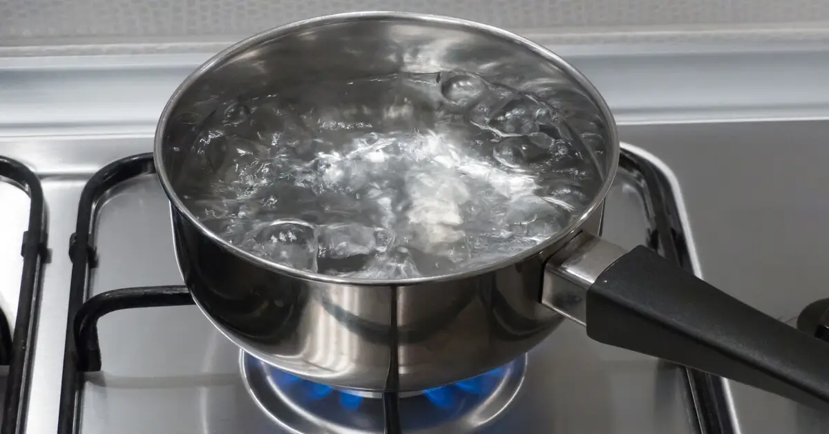 Pot of boiling water on stove to use for seed scarification.